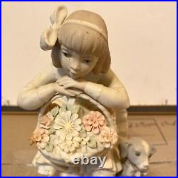 Lladro sitting girl with dog and a basket of flowers
