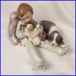 Llardo Porcelain Figurine 1987 Sleeping Boy with Dog Puppies 7 x 6.5 x 3.5