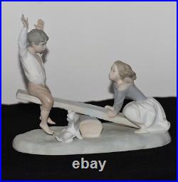 NAO Lladro Spain Large Bisque Porcelain Boy and Girl on Seesaw with Dog