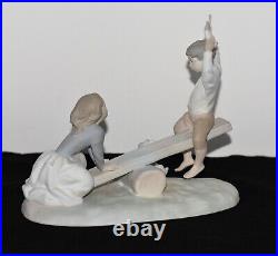 NAO Lladro Spain Large Bisque Porcelain Boy and Girl on Seesaw with Dog