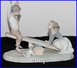 NAO Lladro Spain Large Bisque Porcelain Boy and Girl on Seesaw with Dog