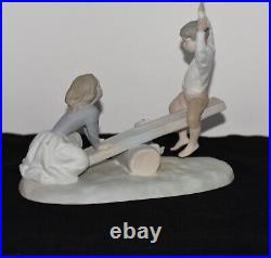 NAO Lladro Spain Large Bisque Porcelain Boy and Girl on Seesaw with Dog