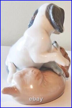 NAO by Lladro Two Dogs Playing Figurine. Moving