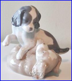 NAO by Lladro Two Dogs Playing Figurine. Moving