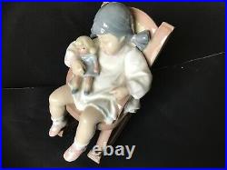 New listing Lladro girl on rocker with a dog. Free shipping 5 in. Tall
