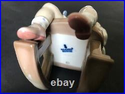 New listing Lladro girl on rocker with a dog. Free shipping 5 in. Tall