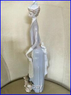 Retired Lladro figurine. Lady with umbrella and dog