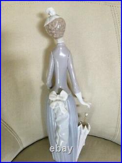 Retired Lladro figurine. Lady with umbrella and dog