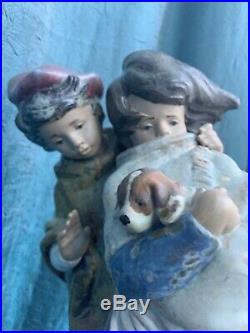 Vintage Lladro Boy And Girl Holding a Dog, 14 tall